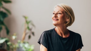 A portrait of a smiling retired Caucasian female contemplating while enjoying her leisure time.
