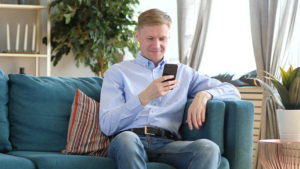 Man Browsing on Smartphone, Searching